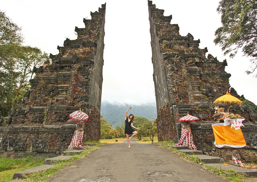 woman in front of structure.